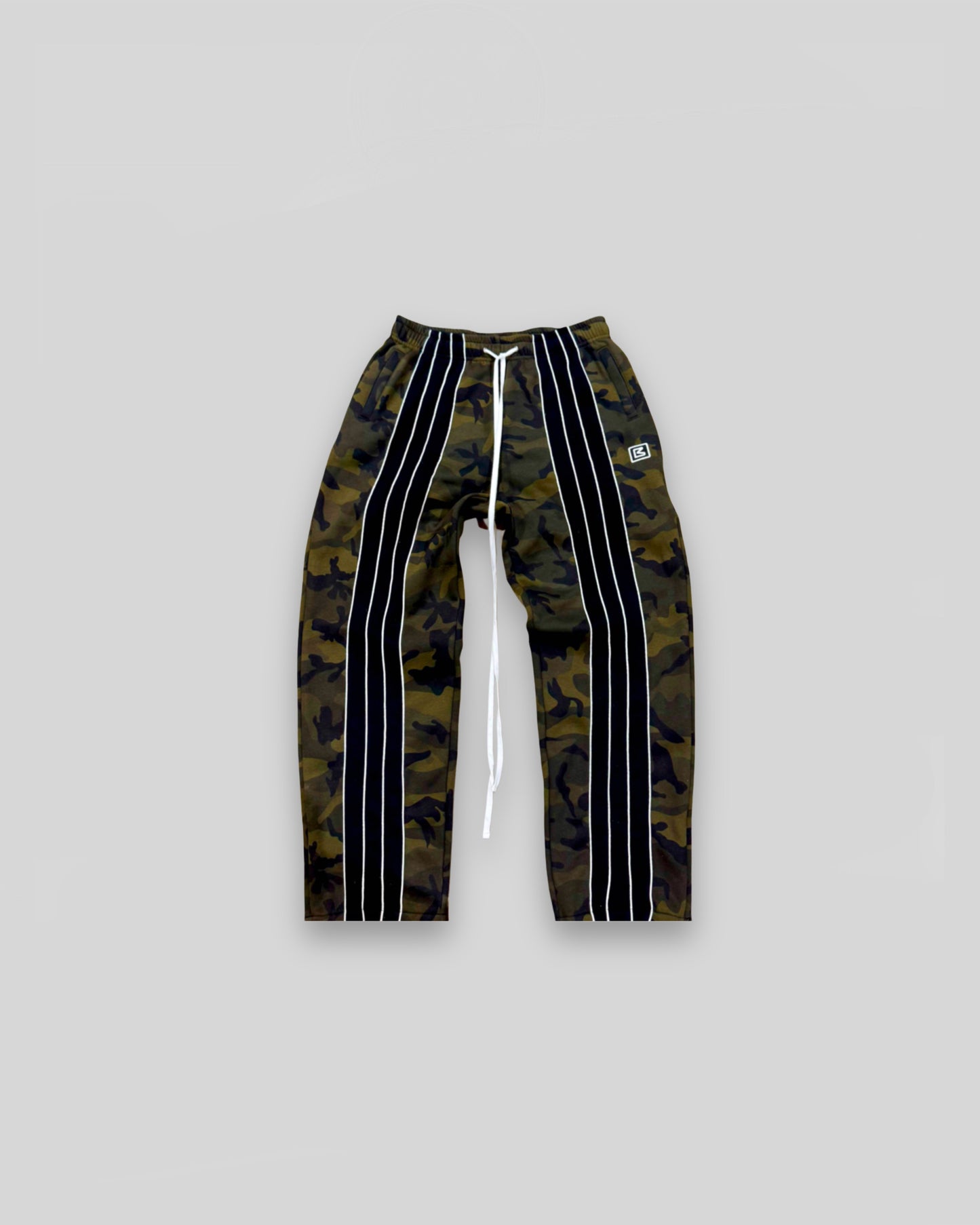 Out of Bias clothing brand “Retro” Trackpants that features Out of Bias clothing brand signature front striped detailing. Also features Out of Bias clothing brand signature extra long drawstring. Made of 100% French Terry Cotto. Out of Bias clothing brand made these trousers with the perfect baggy fit.