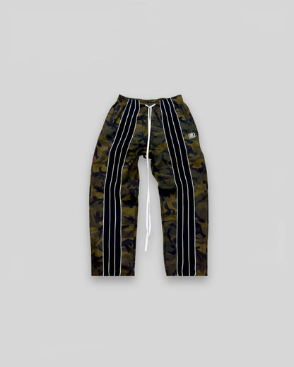 Out of Bias clothing brand “Retro” Trackpants that features Out of Bias clothing brand signature front striped detailing. Also features Out of Bias clothing brand signature extra long drawstring. Made of 100% French Terry Cotto. Out of Bias clothing brand made these trousers with the perfect baggy fit.