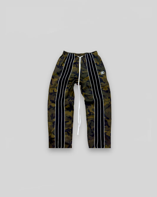 Out of Bias clothing brand “Retro” Trackpants that features Out of Bias clothing brand signature front striped detailing. Also features Out of Bias clothing brand signature extra long drawstring. Made of 100% French Terry Cotto. Out of Bias clothing brand made these trousers with the perfect baggy fit.